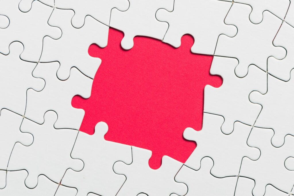 Jigsaw puzzle game piece on red background for business theme design